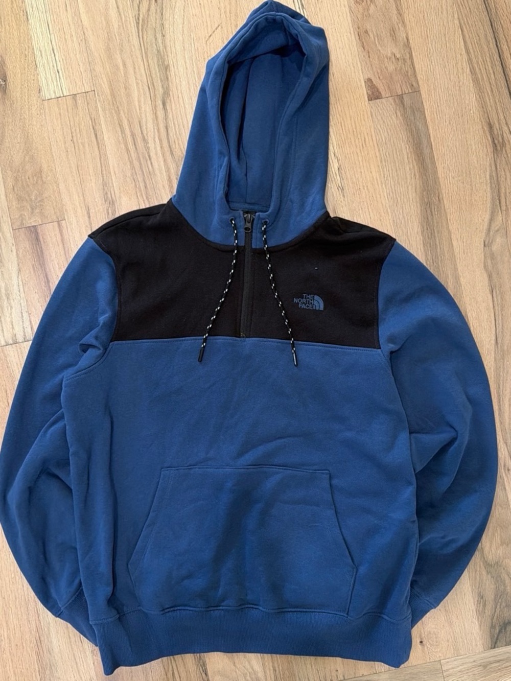 The North Face blue and black color-blocked quarter zip hoodie